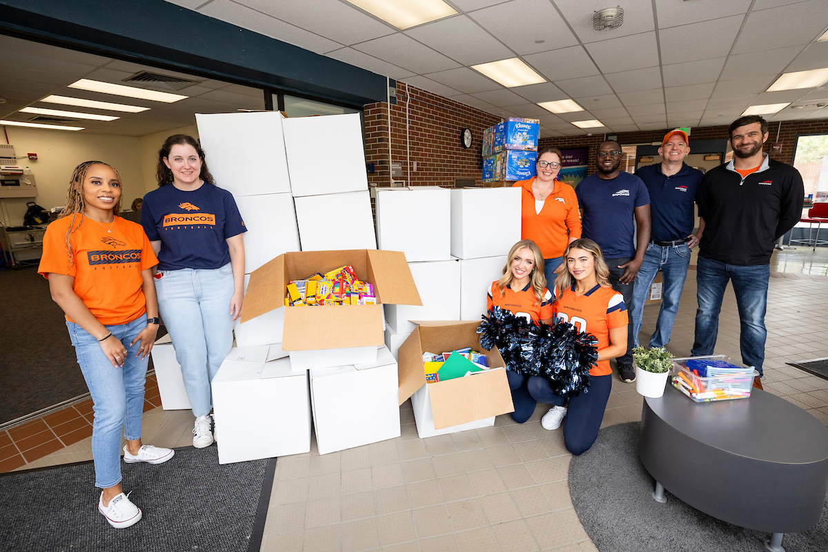 Broncos and Empower School Supplies Drive